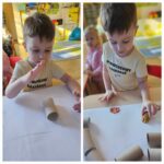 Dzieci wykonują pracę plastyczną na Dzień Dinozaura